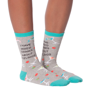 Flat lay showcasing a pair of 'I Have Mixed Drinks About Feelings' socks, ideal for showing the overall design and color scheme.
