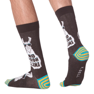 Lifestyle shot of 'No Prob Llama' socks on a person's feet. Shows the socks from the side and back.