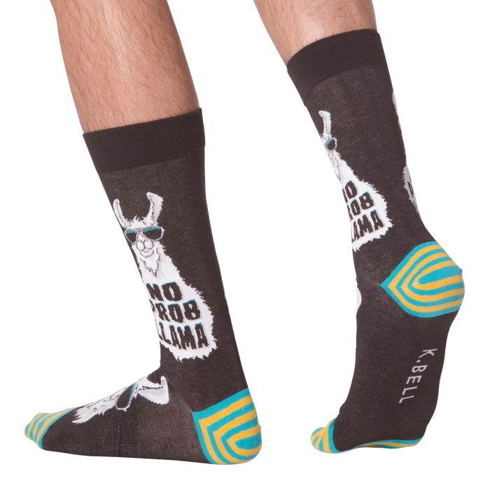 Lifestyle shot of 'No Prob Llama' socks on a person's feet. Shows the socks from the side and back.