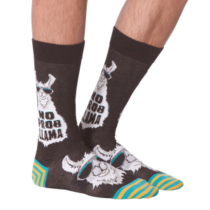 Another lifestyle shot of 'No Prob Llama' socks. Shows the socks on a person's feet from an angle.