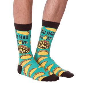 Another product shot of the 'You Had Me at Tacos' socks, showcasing the full sock design from a slightly different angle.
