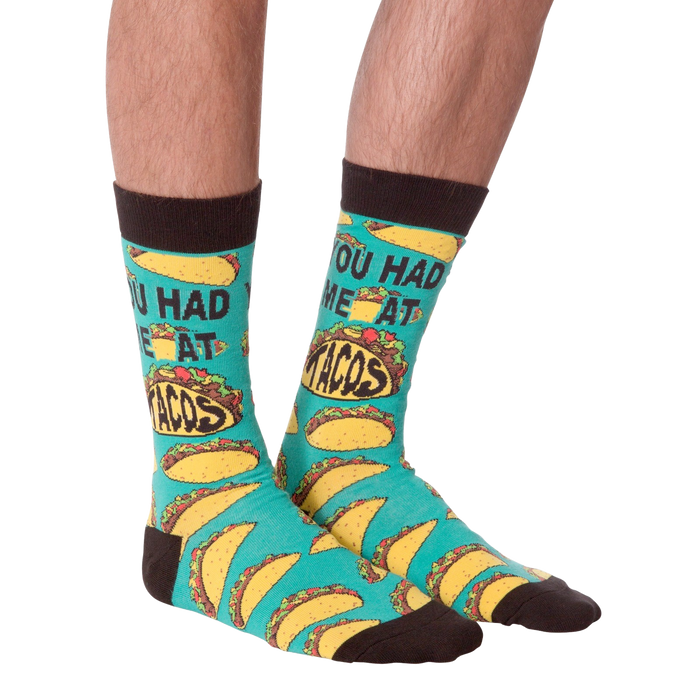 Another product shot of the 'You Had Me at Tacos' socks, showcasing the full sock design from a slightly different angle.
