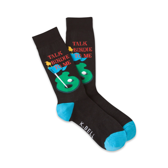 mens talk birdie to me crew socks in black with blue toe and heel, featuring cartoon bird golfer on putting green.   