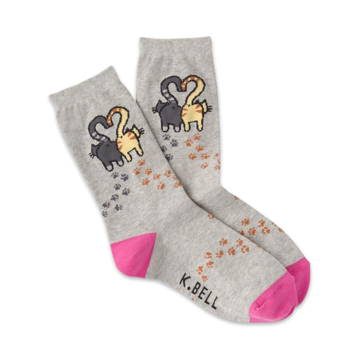 Pair of grey crew socks with pink heels and toes. Design features two cats forming a heart shape and scattered paw prints. }}