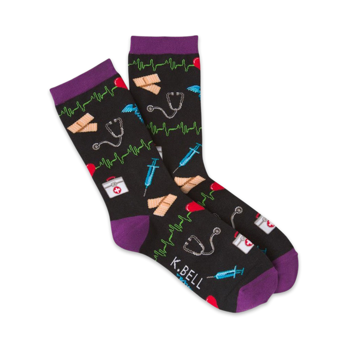 Lifestyle shot of black medical socks with purple cuffs, showing the socks on a person's feet from the ankles down.