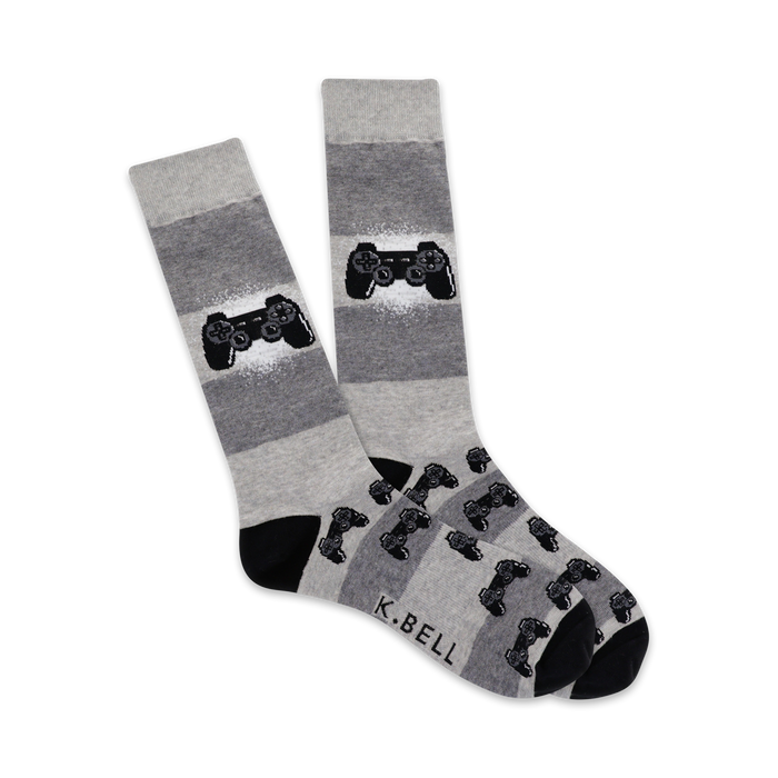 Pair of grey and black crew socks.  A large game controller is featured on the leg, with smaller controllers repeating on the foot. }}