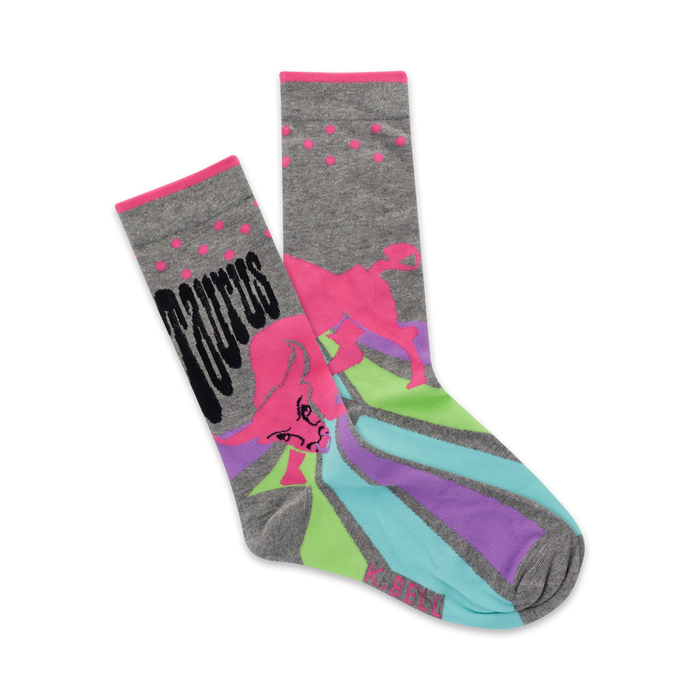 A pair of gray crew socks with a pink bull and retro rainbow design. The word 'Taurus' is featured prominently. }}