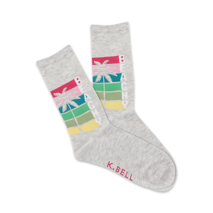 Pair of grey crew socks with a retro-style graphic. The design includes a palm tree and the word 'Beachy' in multicolored stripes. }}