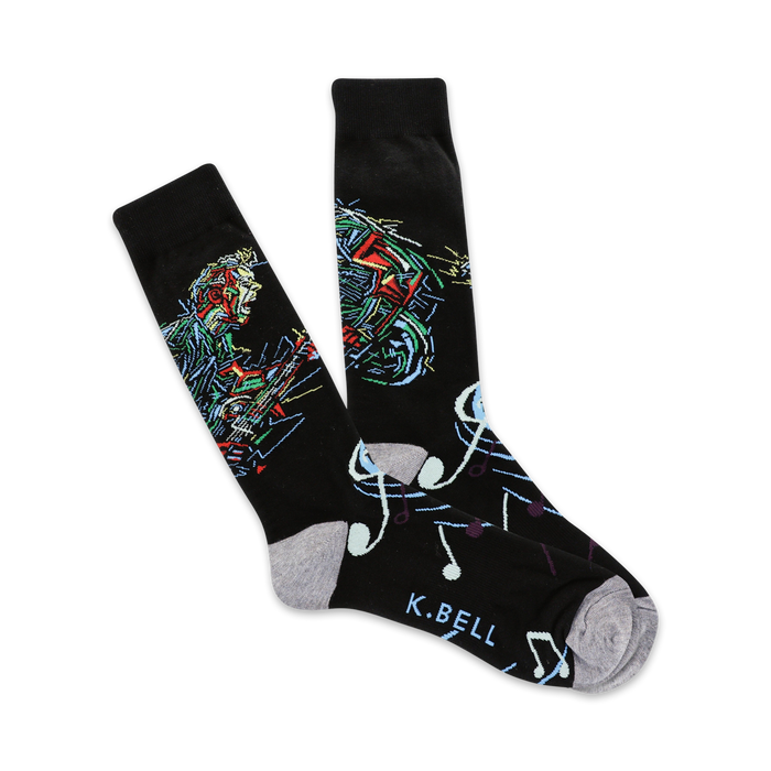 black crew socks with colorful guitar and music note pattern for men, supporting music education.   }}