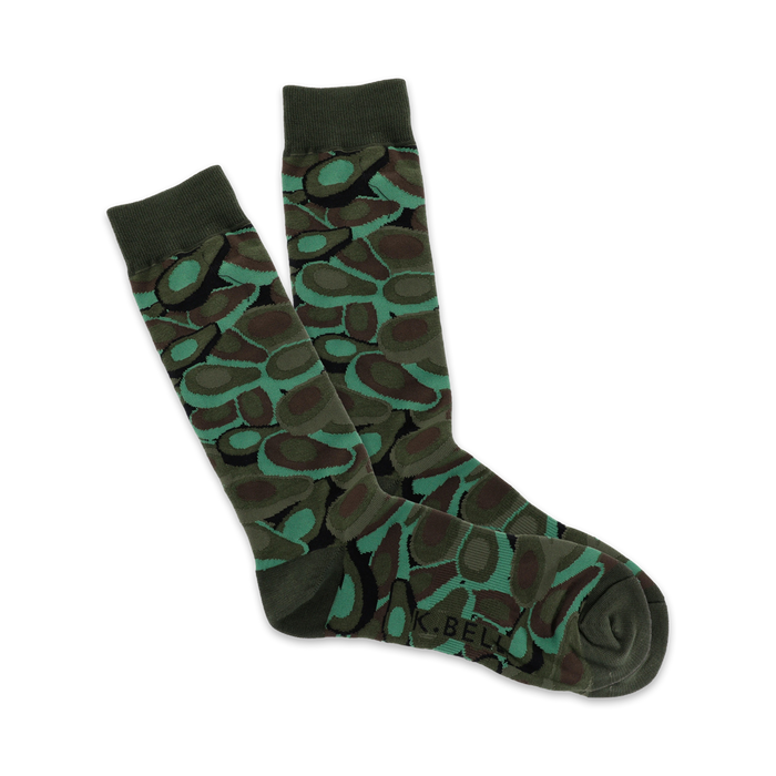 Pair of crew socks in dark green and teal, featuring an avocado-inspired camouflage pattern. }}