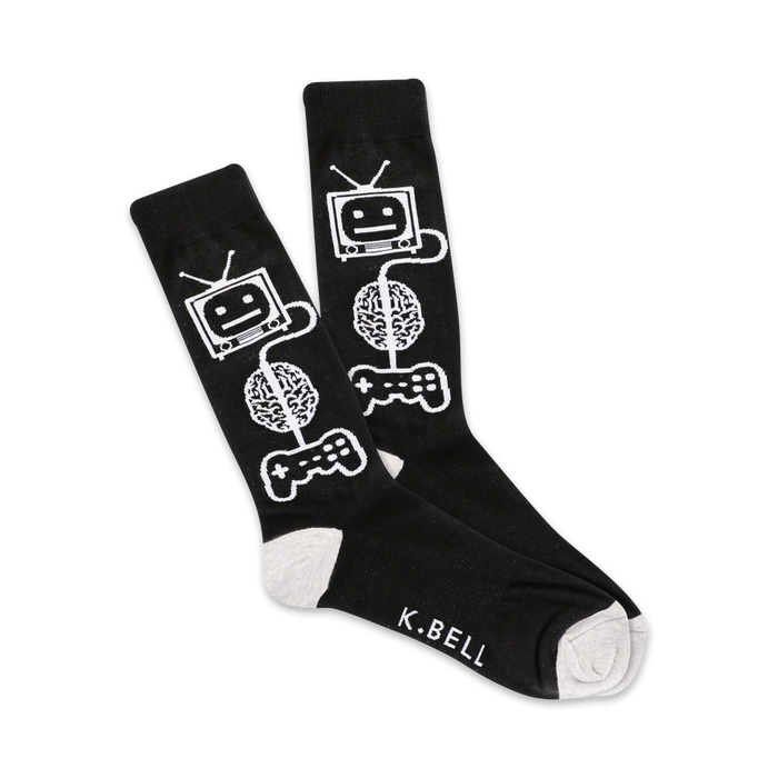Pair of black crew socks with a white design featuring a retro TV, brain, and game controller. The socks have grey cuffs and 'K.BELL' is subtly printed on the foot. }}