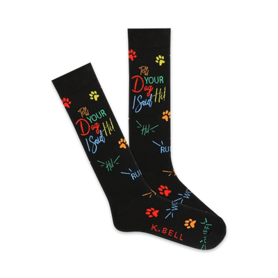 A pair of black crew socks with colorful paw prints and the text "Tell Your Dog I Said Hi" in rainbow lettering.