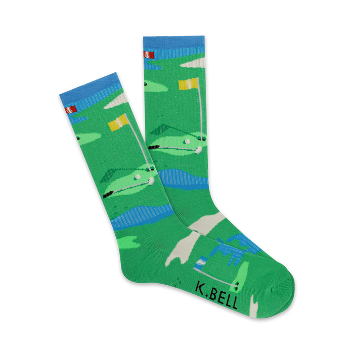 Pair of crew socks showcasing a playful golf course design. Predominantly green with blue water features and yellow flags.  'K.BELL' is subtly printed on the sole. }}