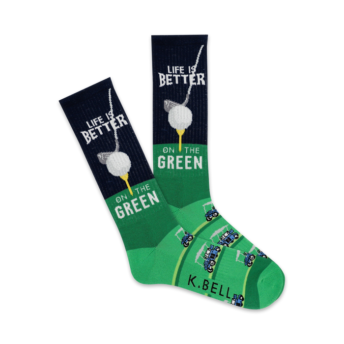 dark green crew socks with a white golf ball on tee and black and white golf cart pattern. 'life is better on the green' is written on top of each sock.   }}