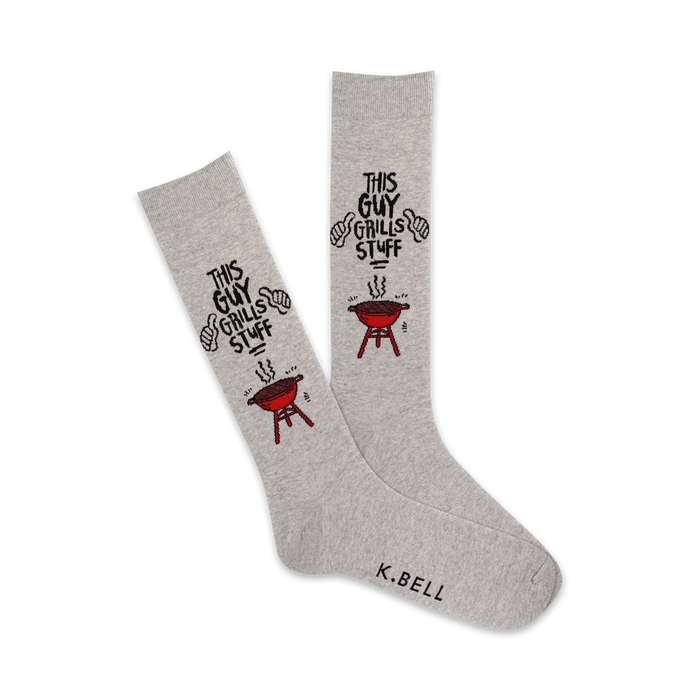 A pair of grey crew socks with a red grill and the text 'This Guy Grills Stuff'. }}