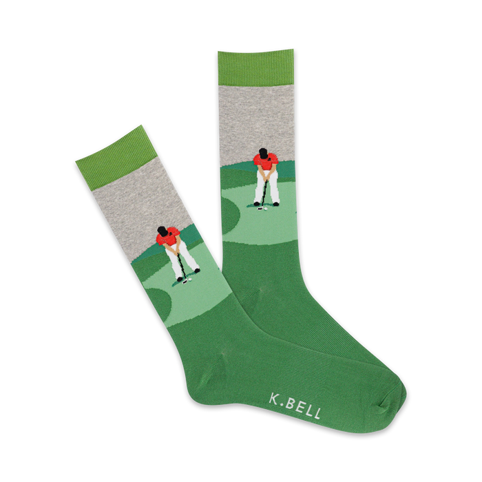 dark green crew socks with a gray cuff and light green toe. pattern of a golfer in a red shirt and khaki pants putting on a golf course.   }}
