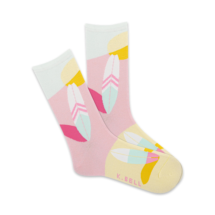 Pair of crew socks in pink, mint green, and yellow. Features a geometric design with stylized feather patterns. }}