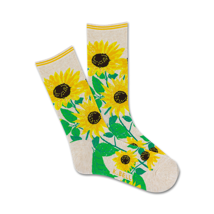 Cream crew socks featuring a cheerful design of yellow sunflowers and green leaves. A great way to brighten up your day! }}