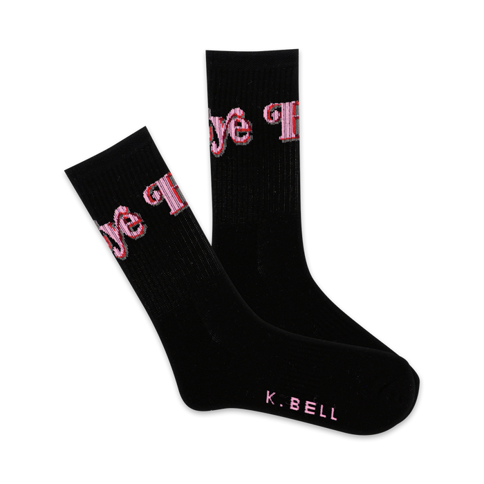 Pair of black crew socks with a pink 'Hi Bye' graphic. The socks are black with pink lettering and feature a small K.BELL logo on the sole. }}