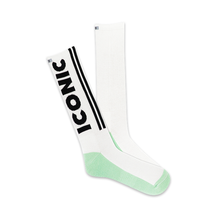 mens crew length athletic socks in black, white, and green with black iconic lettering    }}