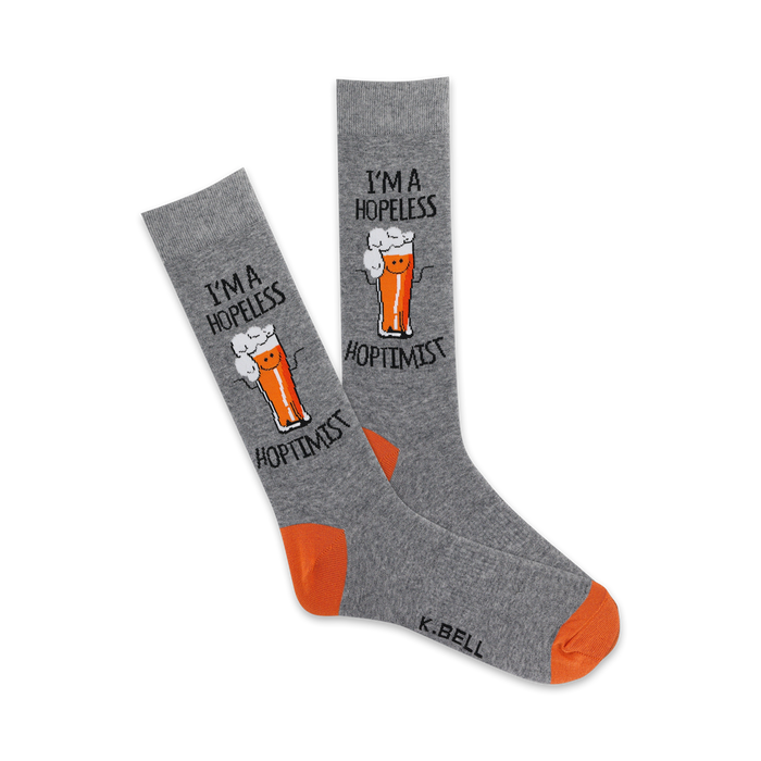 Pair of grey crew socks with an orange heel and toe. Features a graphic of a beer glass with a smiling face and the text 'I'm a Hopeless Hoptimist'. }}