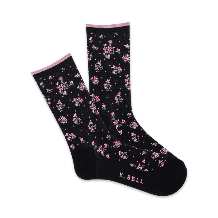 Pair of black crew socks with a delicate pink and green floral pattern.  Features a subtle pink cuff and 'K.BELL' logo.