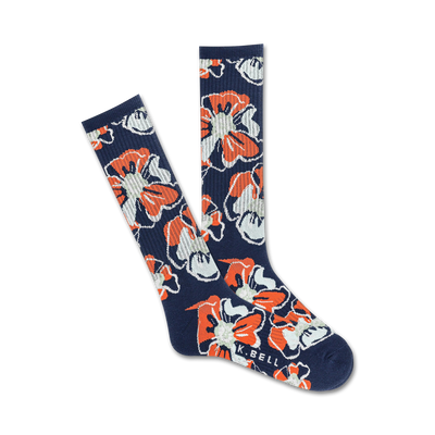 Pair of navy blue crew socks with a repeating pattern of orange and white stylized hibiscus flowers.