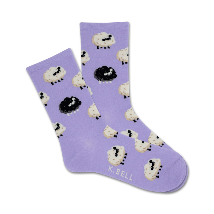Pair of lavender crew socks with a repeating pattern of cartoon black and white sheep. }}