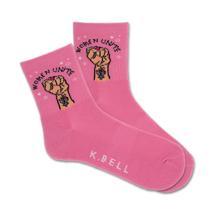 Pair of pink crew socks with a graphic of a raised fist and the text 'Women Unite'.