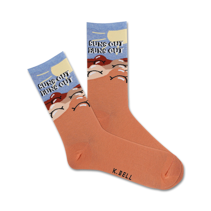 Pair of peach crew socks with a light blue sky, sun, and buns design. Text reads 'Suns Out Buns Out'. }}