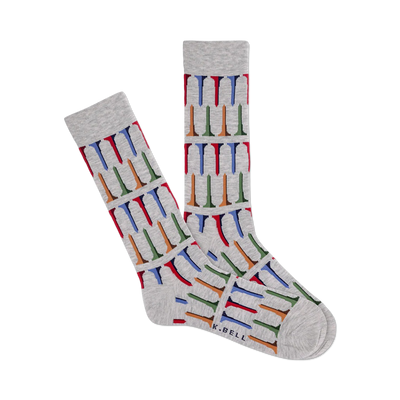 Pair of heather gray crew socks with a repeating pattern of multicolored golf tees. The socks are shown laid flat and feature a subtle 'K.BELL' brand marking.