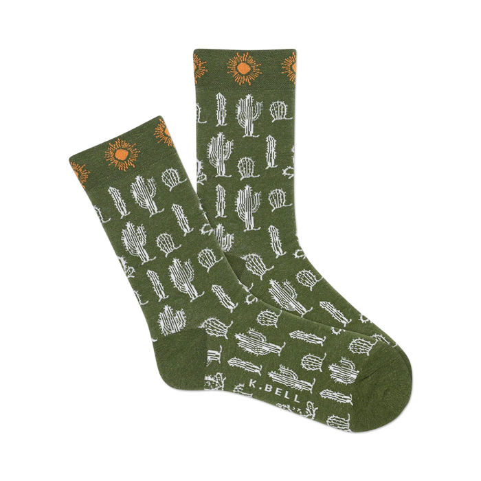 A pair of olive green crew socks with a pattern of white cacti and orange suns. }}