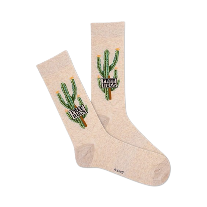 A pair of beige crew socks featuring a whimsical design of cacti holding signs that say 'Free Hugs'. }}