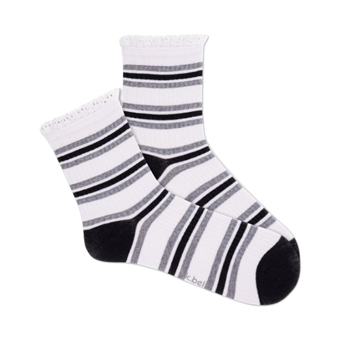 Close-up view of a pair of white and black striped crochet lace ribbed quarter socks.