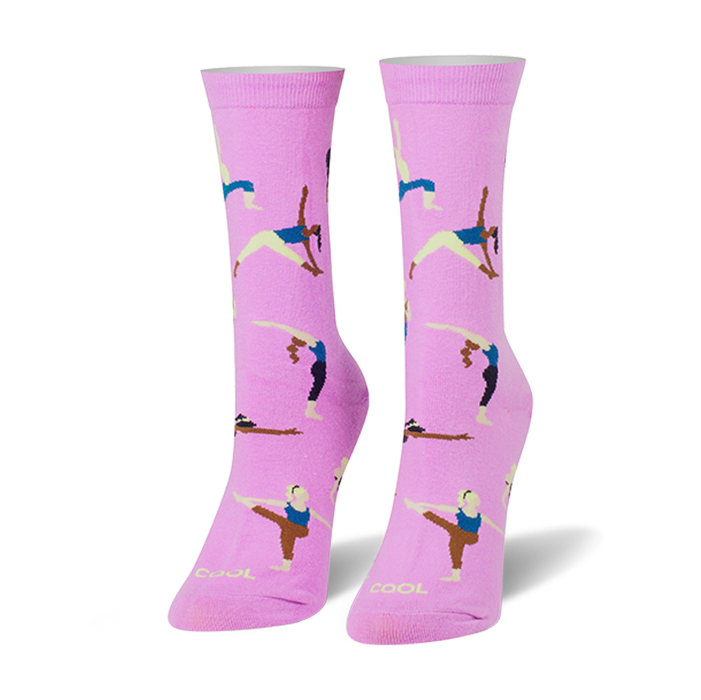 Pair of women's crew socks in light pink, featuring colorful illustrations of women in various yoga poses. }}