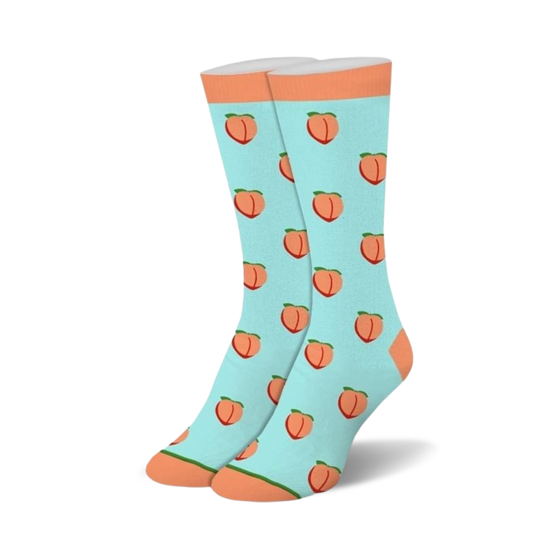Light blue crew socks featuring a repeating pattern of orange peaches with green leaves and solid peach colored cuffs.