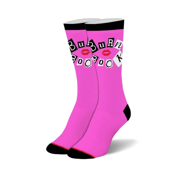 Bright pink crew socks with black cuffs, heels, and toes. Design includes 'BURN BOOK' in magazine letters and red lips. }}