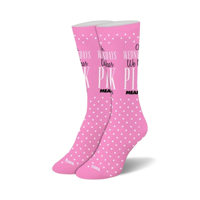 Pair of pink crew socks with white polka dots and the text