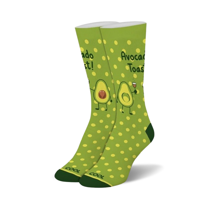 womens crew socks with bright green polka dots and friendly avocado cartoons. avocado toast is written on top of each sock and one avocado holds a glass of red wine.   }}