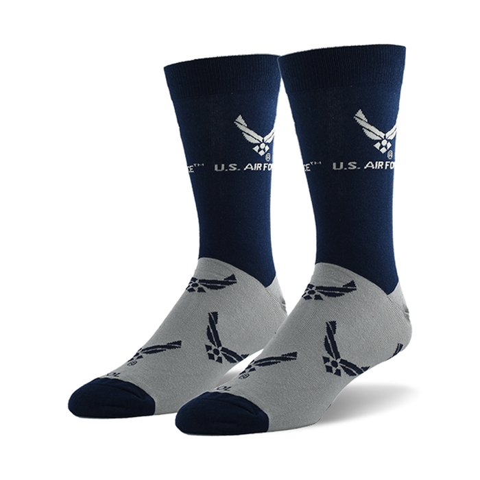 Pair of navy blue and grey crew socks. The socks feature a repeating pattern of the US Air Force emblem on a grey background and a larger emblem on the navy blue top section. }}