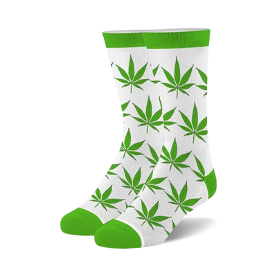 Pair of crew socks with a white background and bright green marijuana leaf pattern. Lime green cuffs.