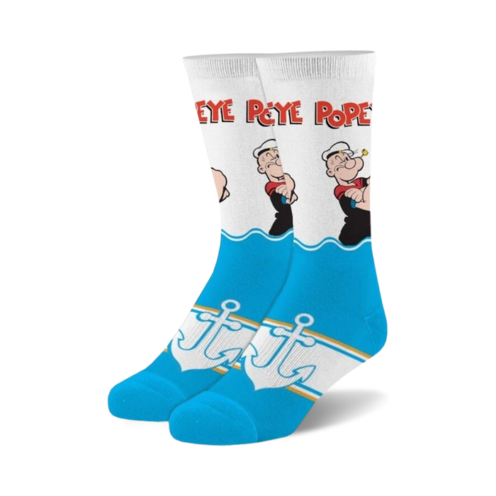 Pair of crew socks in white and blue, featuring Popeye the Sailor Man graphics, anchors, and wave designs.