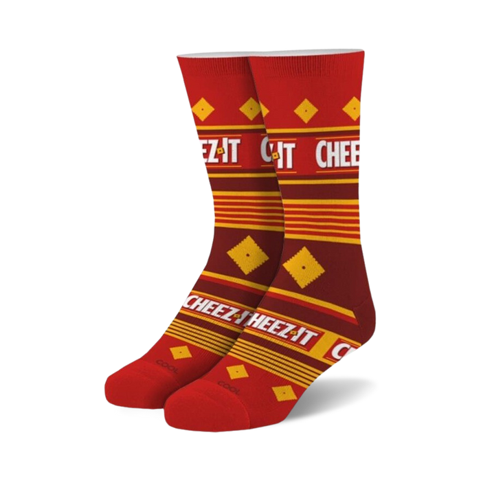 Pair of crew socks in red and gold featuring a repeating Cheez-It cracker box pattern and text. }}