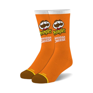 Pair of orange crew socks with the Pringles Cheddar Cheese logo and Mr. Pringle's mustache. White accents and brown heel.