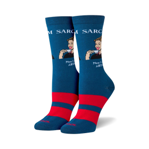Pair of teal crew socks with red stripes and a retro-style illustration of a woman sipping tea. The text 'Sarcasm' and 'Now Served All Day!' is featured on the socks.