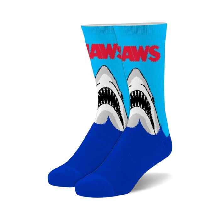 Pair of fuzzy crew socks; blue and light blue with Jaws logo and graphic of two great white sharks emerging from water.