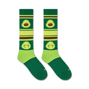 A pair of green socks with brown and avocado-patterned stripes.