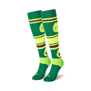 dark green knee-high socks features light green toe, heel, top cuff, avocado pattern, and brown, light yellow bands.   