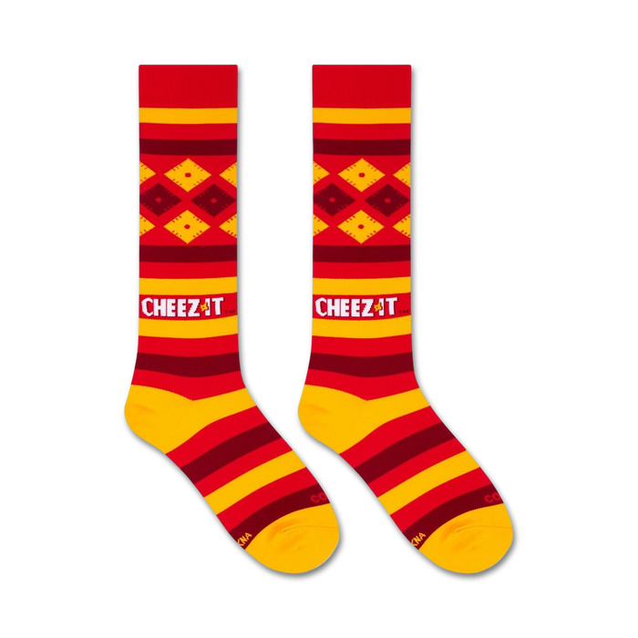 Flatlay product shot of two Cheez-It-themed knee-high socks.