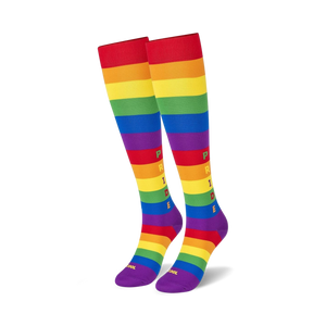 Close-up detail shot of the rainbow stripes and 'PRIDE' lettering on the knee-high socks.